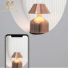 Retro Acrylic LED Desk Lamp Glow displayed next to a smartphone, showcasing its warm glow and retro design.