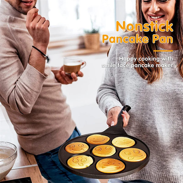 7-Hole Smile Face Non-Stick Breakfast Pan with smiley face pancakes being cooked.