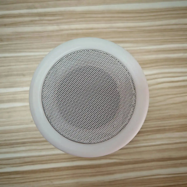 Top view of Smart Portable Plastic LP-25125 Wireless Speaker Lamp showcasing the speaker mesh design.