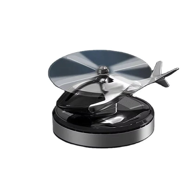 Solar-Powered Rotating Helicopter Car Air Freshener on a black base with a rotating propeller, adding freshness and style.