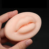 Silicone Lip Tattoo Practice Skin held in a hand, showcasing realistic lip contours for tattoo practice.