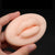Silicone Lip Tattoo Practice Skin held in a hand, showcasing realistic lip contours for tattoo practice.