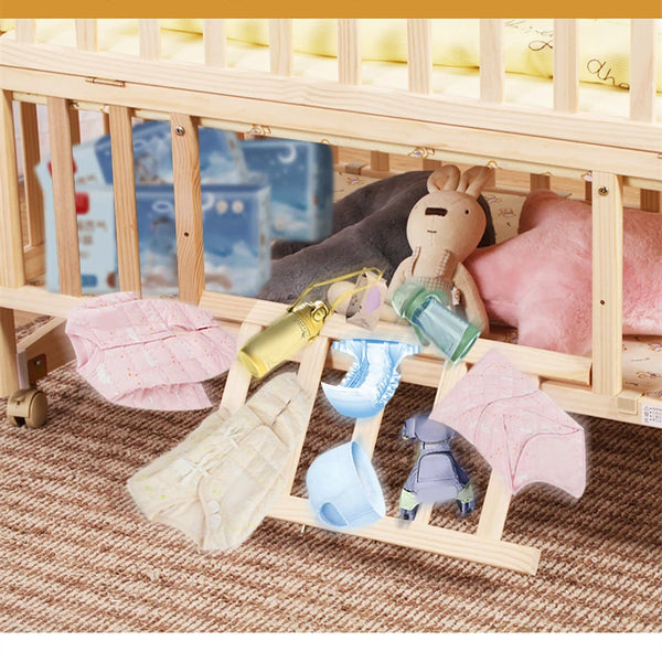 Multi-functional Wood Baby Crib Kids Cot with hanging toys and soft blankets, providing a cozy space for infants.