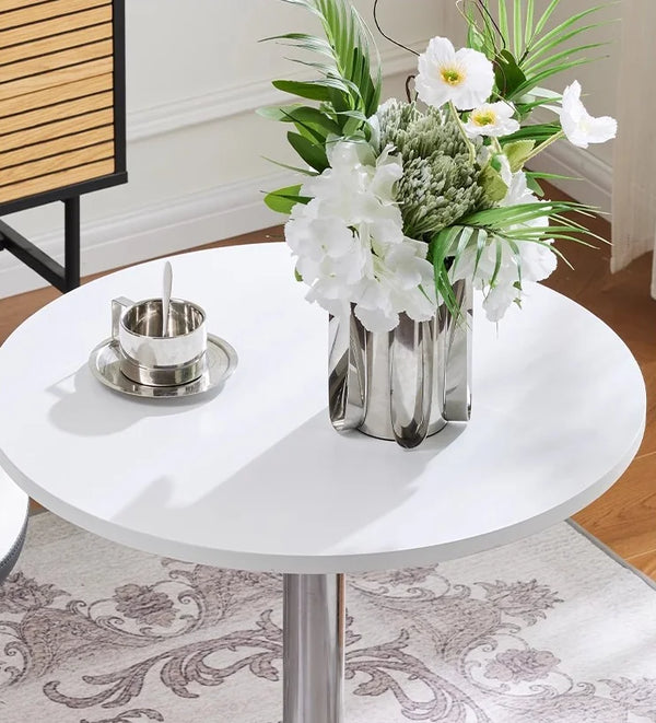 Adjustable Height Bar Table with Metal Round Top featuring a sleek design with flowers and decor.