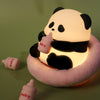 The Sitting Panda USB Night Light with a cute panda holding a bottle, surrounded by mini bottles.