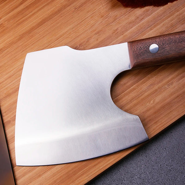Handmade Forged Heavy Duty Cleaver on a wooden cutting board, showcasing a robust stainless steel blade.