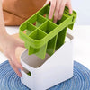 Person organizing utensils with a green divider on the Modern Multifunctional Kitchen Countertop Storage Rack.