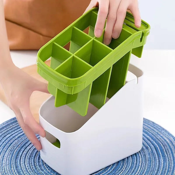 Person organizing utensils with a green divider on the Modern Multifunctional Kitchen Countertop Storage Rack.