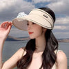 Women Rechargeable Cooling Fan Sun Visor worn by a woman by the water, showcasing its stylish and functional design.