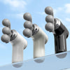 Three interchangeable heads of the 3-Head Body Massager in black, white, and gray against a blue sky.