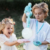 Kids enjoying the Elastic Magic Wand Smoke Bubble Machine, creating magical mist-filled bubbles outdoors.