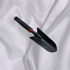 Outdoor Gardening Hand Shovel on a white fabric background, ideal for planting and soil loosening.