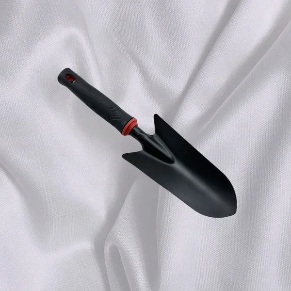 Outdoor Gardening Hand Shovel on a white fabric background, ideal for planting and soil loosening.
