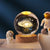 Crystal Milky Way LED Globe – 6 cm on a wooden base with astronauts figurines.