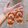 Super Cute Rotatable Head Capybara Keychain held in a hand, showcasing its adorable design and outfit.