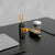 Transparent Capsule 5000mAh Mini Power Bank on a desk with smartphone and airpods, showcasing its portable charging design.