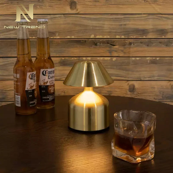 Retro Acrylic LED Desk Lamp Glow on a table next to drinks, creating a cozy atmosphere.
