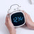 Digital Loud Bell Alarm Clock with Snooze displaying time in hands of a user with sleek design.