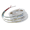 5m 12V 2835 SMD LED Strip Light rolled up on a spool ready for installation in various lighting applications.