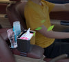 Car Armrest Cup Holder Storage Box with drinks and small items in a car interior for easy access.