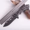 3D Embossed Dragon Folding Survival Knife displayed next to a ruler for size comparison