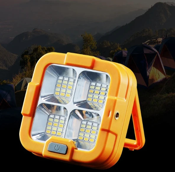Portable LED Solar Power Flood Light with four bright LED panels, ideal for outdoor lighting and emergencies.