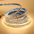 5m 12V 2835 SMD LED Strip Light coiled on a spool, showcasing its flexible and bright illumination.
