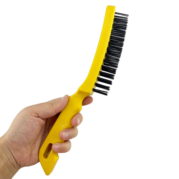 Heavy Duty Steel Wire Scratch Brush in hand, designed for tough cleaning of metal surfaces.