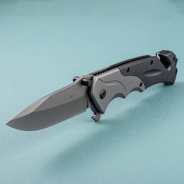 G10 Stainless Steel Folding Hunting Knife displayed on a blue background, showcasing its rugged design and sharp blade.