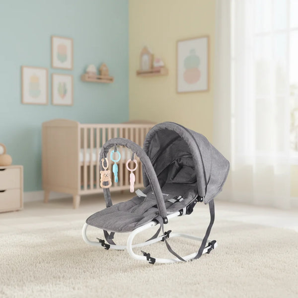 Ergonomic Baby Bouncer Rocker Chair set in a cozy nursery with toys attached, providing comfort and support for babies.