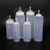 Food Grade Squeeze Sauce Bottle Set featuring various sizes of clear squeeze bottles for easy condiment dispensing.