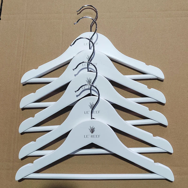Boutique Wooden Kids Clothing Hanger in a stacked arrangement, showcasing their premium design for children's clothing.