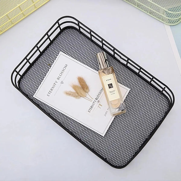 Metal Wire Grid Basket Organizer showcasing a sleek black design, holding a magazine and a perfume bottle.
