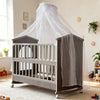 Modern Multifunctional Boys Sleeping Drawer Unit with a sheer canopy in a bright room.
