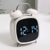 Digital Loud Bell Alarm Clock with Snooze showing time 12:14 on a modern display with classic bells