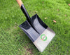 Heavy Duty Steel Garden & Construction Digging Shovel resting on grass, showcasing its durable design.