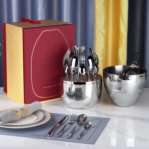 24 Piece Stainless Steel Cutlery Set alongside stylish serving accessories on a dining table.