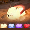Cute Deer RGB Colorful Pat Control Night Light glowing softly as hand touches it.