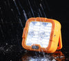 Portable LED Solar Power Flood Light FA-D6 T05 in the rain, providing bright and reliable outdoor lighting.