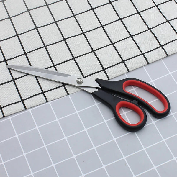 11-inch Stainless Steel Clothing Scissors on fabric for precision cutting.