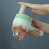 200ML Wireless Mini Electric Food Chopper Garlic Mincer in use, chopping red peppers efficiently.