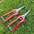 Garden Pruning Shears Stainless Steel 20cm on grass, ideal for precise garden maintenance and cutting.