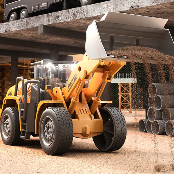 Alloy Construction Vehicles Friction Toy Set featuring a detailed front loader dumping sand on a construction site.
