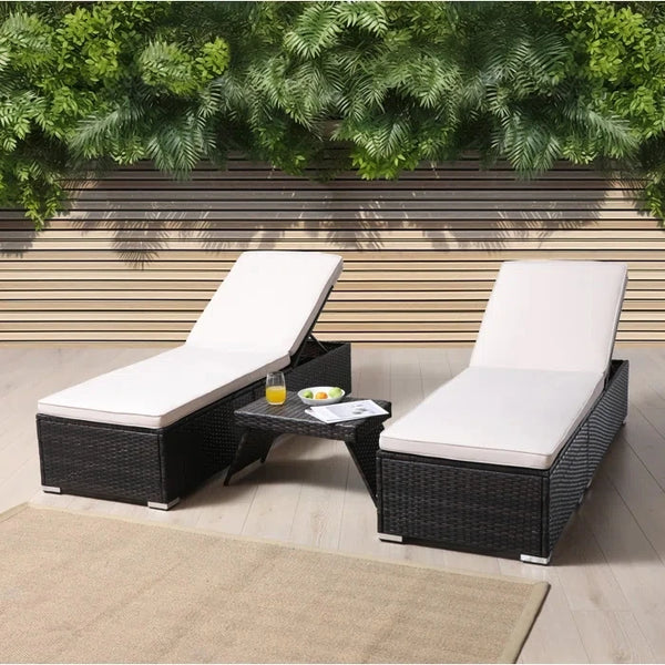 Outdoor Garden Lounge Daybed Wicker Deck Bed featuring two lounge chairs and a side table in a garden setting.