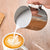 Silver Coffee Latte and Milk Frothing Pitcher 350ML pouring milk into a latte with a leaf design.