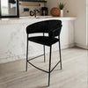 Upholstered Bar Stool with Curved Back and Black Metal Frame in a modern kitchen setting.