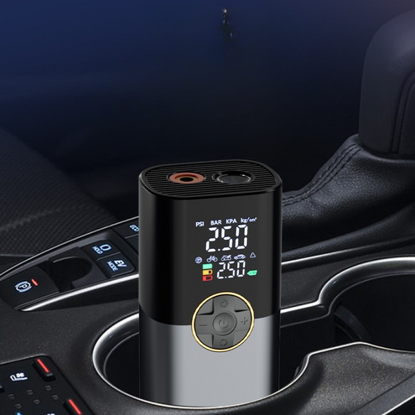 150PSI Dual-Screen Portable Air Compressor in a car cupholder displaying digital pressure readings.