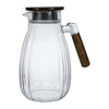 High-Temperature Resistant Dining Table Placemat displayed next to a clear glass pitcher with wood handle.