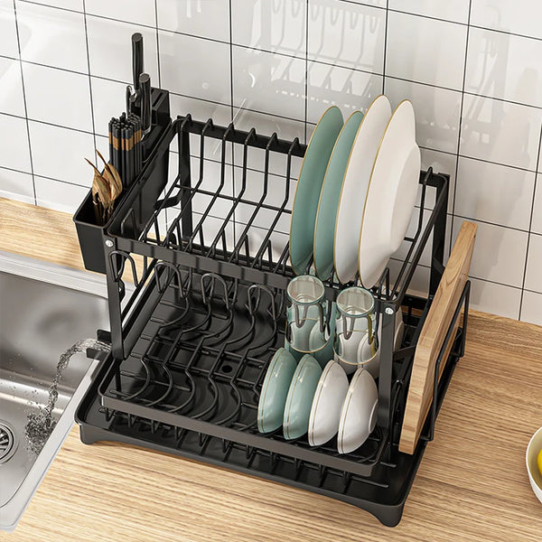 Double Layer Iron Dish Rack with Wine Glass Holder in a kitchen, displaying plates and glasses on a sleek black design.