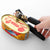 Stainless Steel Manual 3-in-1 Can Opener opening a canned food, demonstrating its ergonomic grip and cutting wheel.